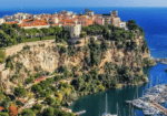 Monaco cityscape overlooking harbor boats.